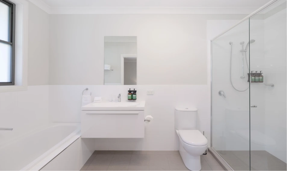 Riverside Oaks Executive Suite bathroom with walk-in shower