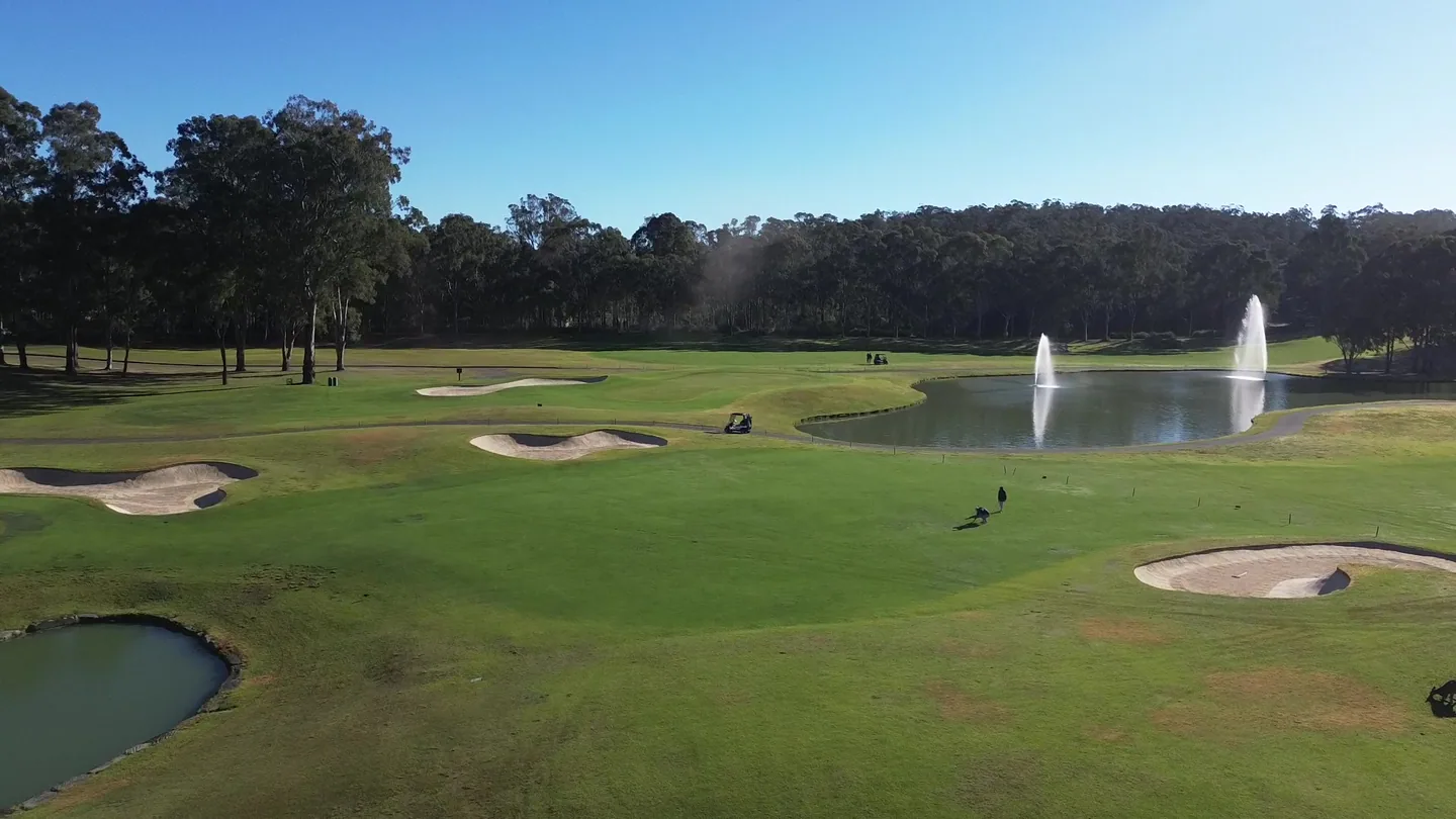 Twin fountains across the fairway at Riverside Oaks
