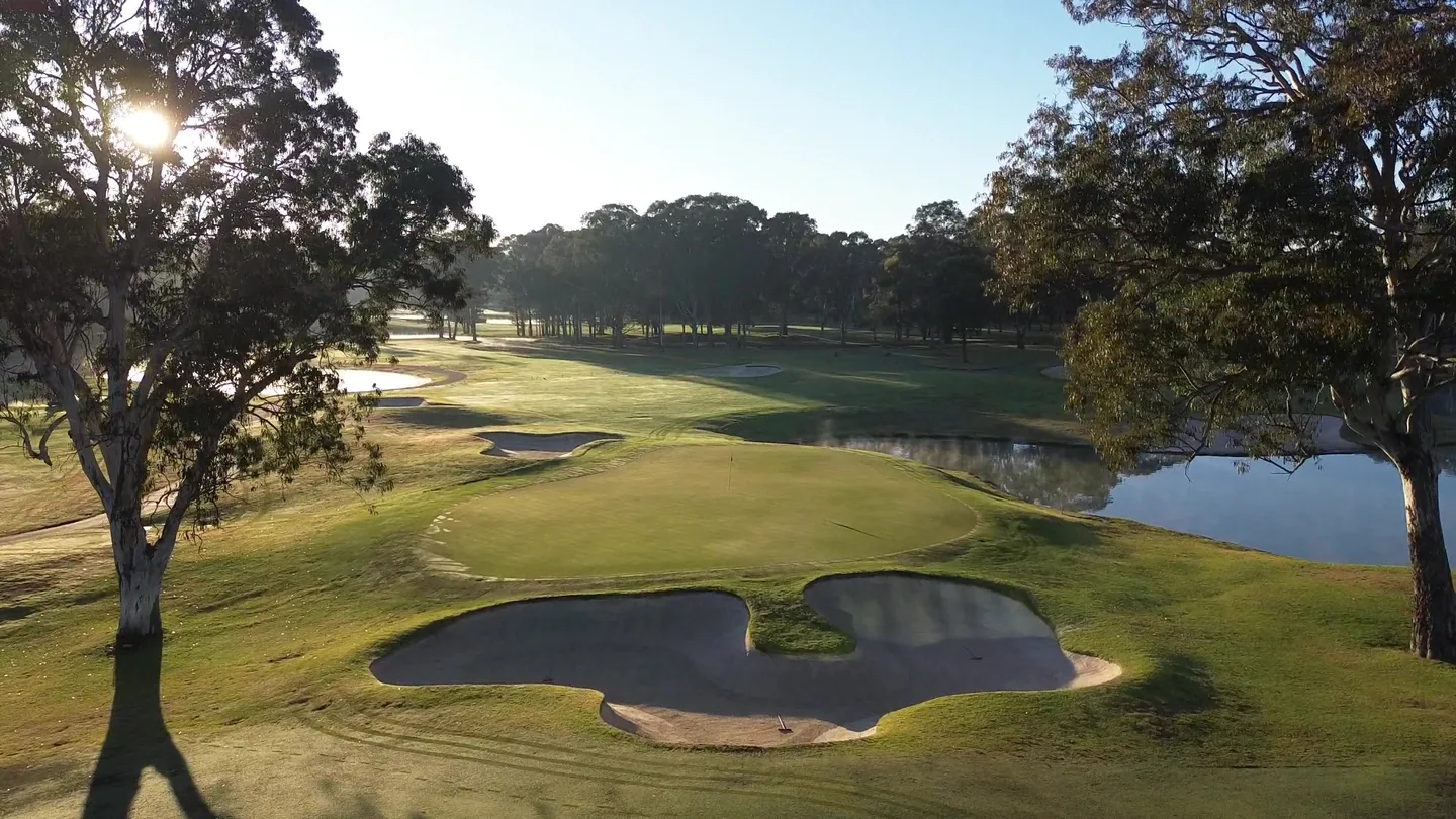 Bunkers and water in morning light at Riverside Oaks