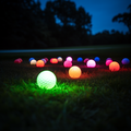 joyousrabbit._12_glow_in_the_dark_golf_balls_scattered_on_a_gol_127f2026-b872-4e9e-8ed3-c4fdb499ac08.png